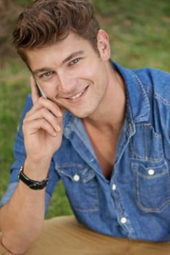 A young man is on the phone