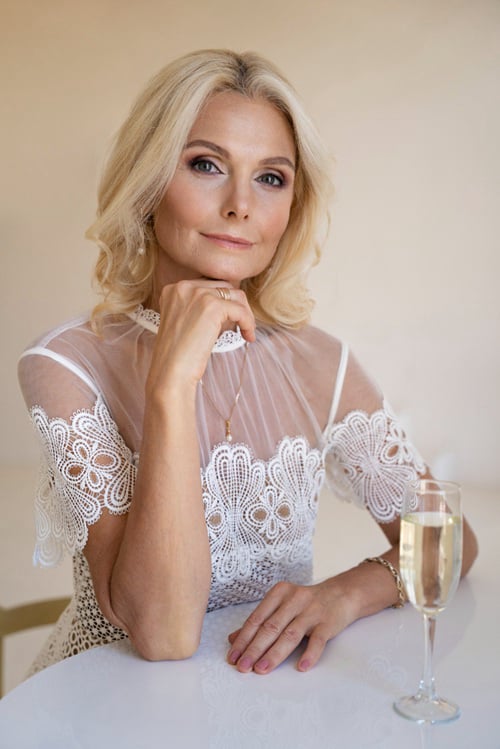 A middle-aged blonde sugar mommy